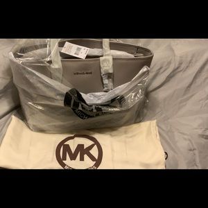 Various Michael Kors Handbags. Some new some used
